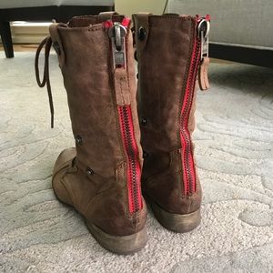steve madden boots with red zipper up the back